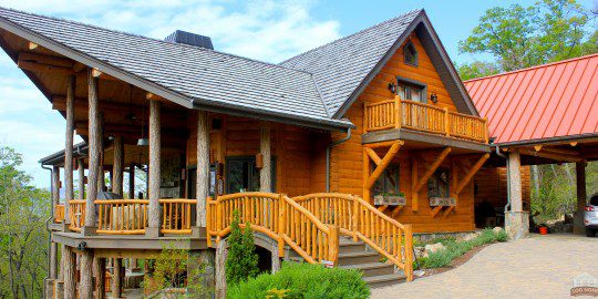 A wooden house with stairs going up to it.