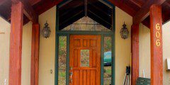A welcoming wooden porch with a bench, perfect for an inviting entry.