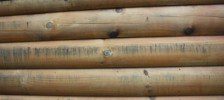 Stacked round log siding with knots